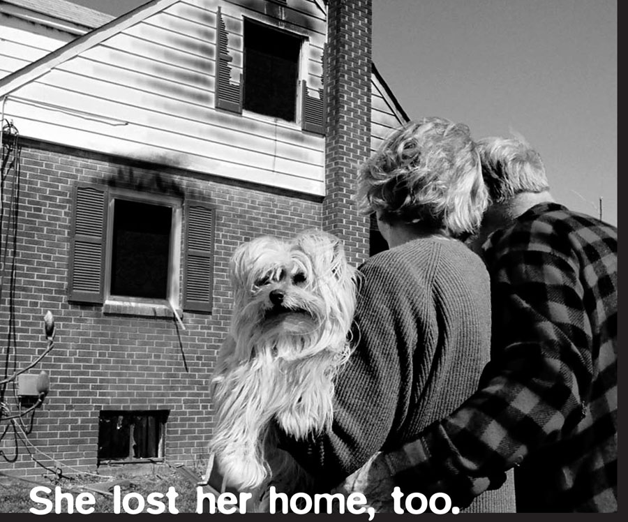 Couple outside a burning home